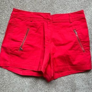 Red shorts with zipper detail in US 2. Fits big. Worn only once.